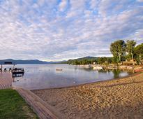 beach on lake george at trout house village resort