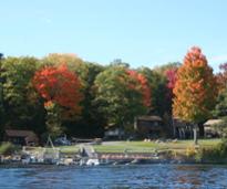 lodging with beach by lake in fall