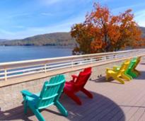 chairs looking out at lake in fall