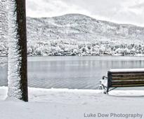 snowy bench in lake george