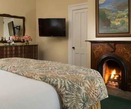 fireplace guest room at the inn at saratoga