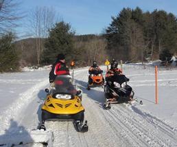 snowmobilers on trail