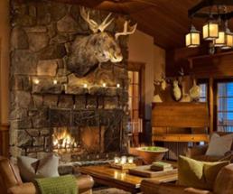 moose head over fire in fireplace