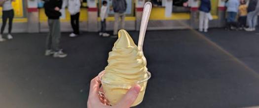 banana ice cream dish held up against martha's dandee creme crowd