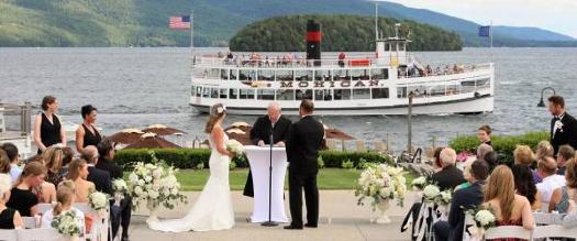 wedding ceremony with lake george steamboat company ship in the background