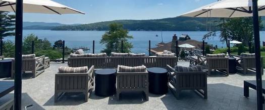 patio chairs on deck overlooking lake george