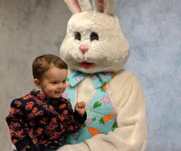toddler sits with easter bunny