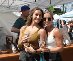 two women at adirondack wine and food festival pose