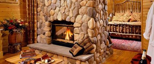 luxury guest room with fire in fireplace