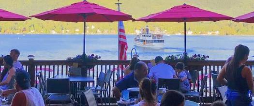 patio dining on lake george with view of steamboat