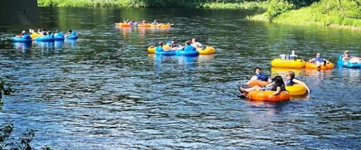 people lazy river tubing