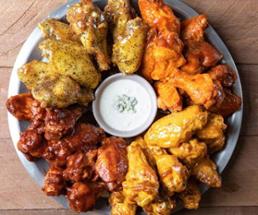 chicken wings surrounding a dip