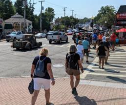 people walking down main road in lake george