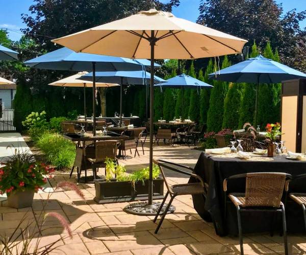 tables and chairs set up on a patio