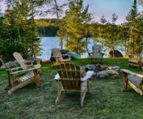 waterfront fire pit with adirondack chairs