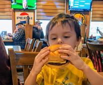 kid eating a burger