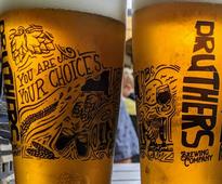 closeup of two Druthers beer glasses