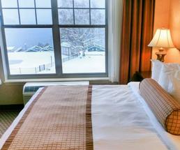 hotel bed by window