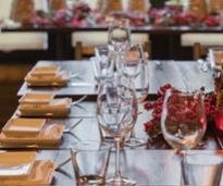 a table with glassware and plates