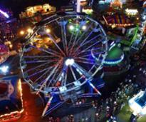 ferris wheel and county fair at night