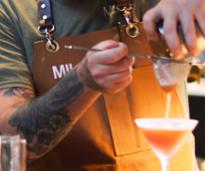 closeup of man mixing a cocktail