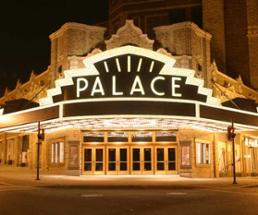 the front of the palace theatre lit up at might
