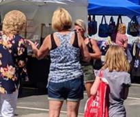 women shopping at an outdoor event