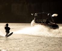 person waterskiing behind a boat