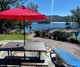 picnic table and pool with view of lake