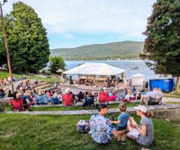 outdoor concert on lake george under tent