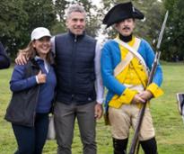 couple poses with fort ticonderoga soldier reenactor 