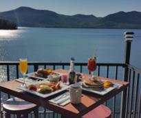 brunch outdoors with a view of lake in bolton landing at blue water manor