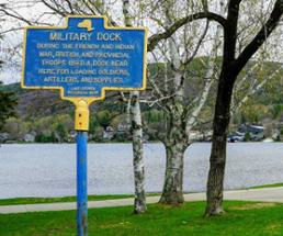 military dock sign by lake george