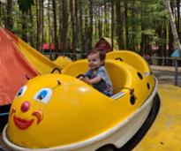 toddler on amusement park ride