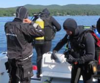 scuba divers on a boat