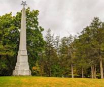 monument and trees in crandall park