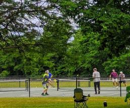pickleball game in hudson river park in queensbury