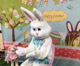 easter bunny waits for children to come sit on his lap