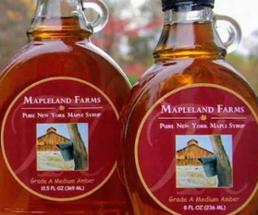 two bottles of mapleland farms maple syrup