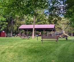 picnic area with grill at delong usher park in lake george