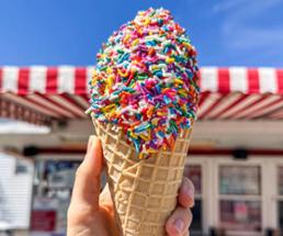 ice cream cone with a ton of rainbow sprinkles