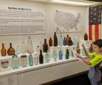 bottles usa sign and exhibit and kids at national bottle museum