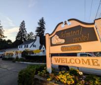 exterior of admiral motel with sign