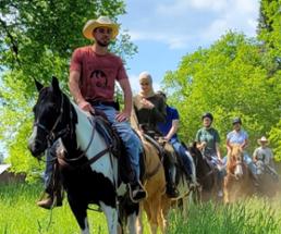 group of trail riders on horseback in saratoga