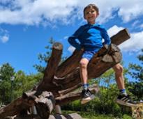 kid on climbing structure