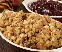 stuffing dish, cranberry dish in background