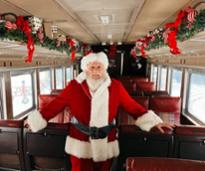 Santa standing inside a train