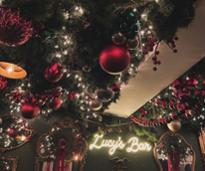 lucys bar with holiday ornaments and decorating on the ceiling