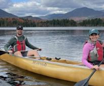 couple in a canoe in the fall