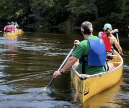 people canoeing in the adirondacks